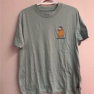 New Balance Sage Green Short‑Sleeve T‑Shirt with Barrel Graphic